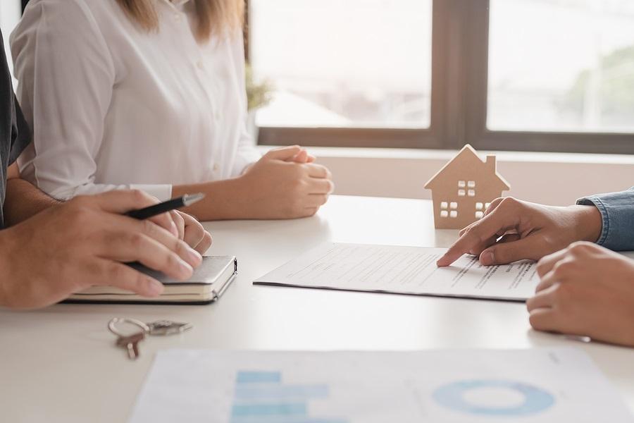 Landlord, realtor pointing sign signature contract rental, purchase, buyer home or apartment with tenant, client after banker agreement mortgage, loan success or done. Property agent concept.